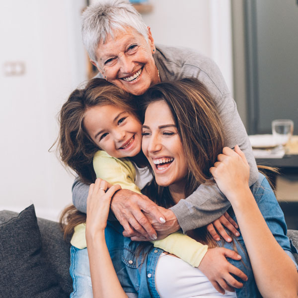 three generations of family smiling
